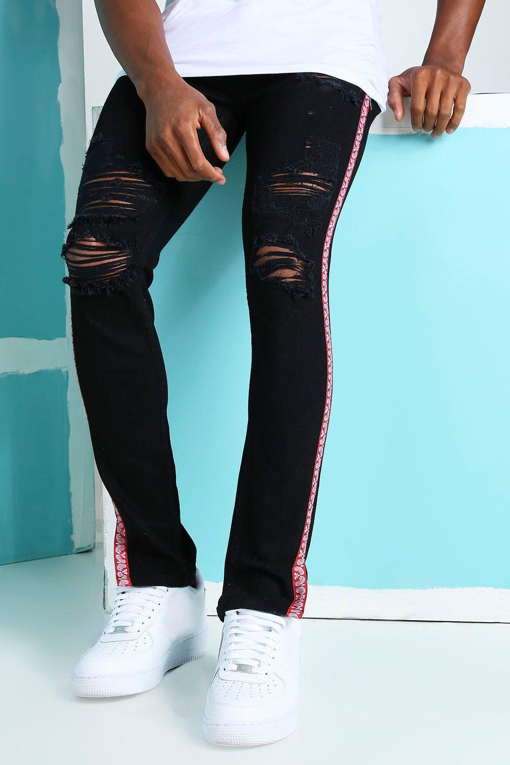 Black ripped jeans with red stripe sales